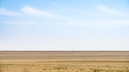 Minimalistic landscape of the Kazakh steppe in Mangistau in May, steppe of the Ustyurt plateau