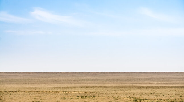 Minimalistic landscape of the Kazakh steppe in Mangistau in May, steppe of the Ustyurt plateau