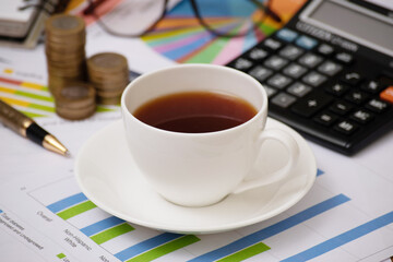 Closeup of black coffee cup on office table