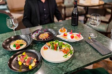 variety of restaurant food dishes on table
