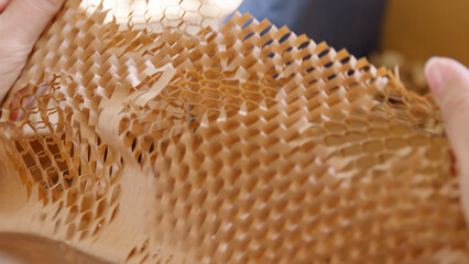 Eco vendor go green packaging parcel carton box in net zero waste store asian seller retail shop. Earth care day small SME owner asia people wrap reuse brown paper pack gift reduce plastic free order.