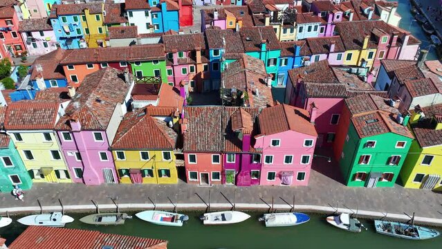Vibrant facades of Burano, scenic canals and fishing town charm near Venice, Veneto, Italy