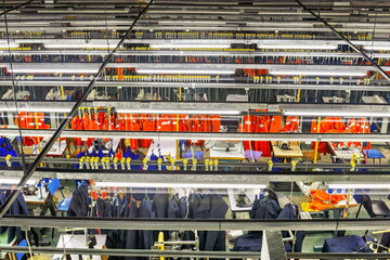 industrial textile factory in africa producing workwear, view from above, high angle, to the sewing...