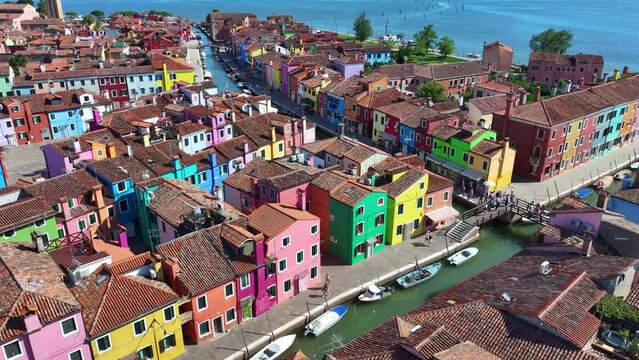Vibrant facades of Burano, scenic canals and fishing town charm near Venice, Veneto, Italy