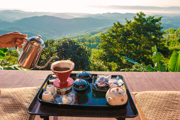 drip coffee in the morning with a look at the mountains of Doi Chang Chiang Rai Thailand
