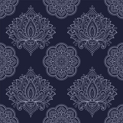 Seamless decorative ornament in ethnic oriental style. Lotus flower and mandala for Henna, Mehndi, tattoo, decoration. Doodle outline hand draw vector illustration.