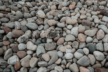 bright and smooth pebbles on the beach close up shot