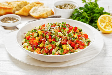 Israeli salad of finely diced veggies in bowl