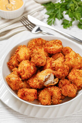 crispy fried panko breaded chicken bites in bowl