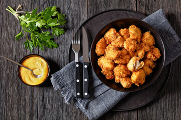 crispy fried panko breaded chicken bites in bowl