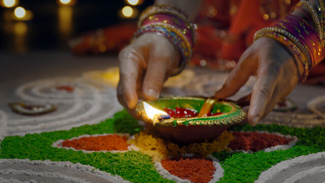 Clay diya lamps lit during diwali celebration, Diwali, or Deepavali, is India's biggest and most important holiday.