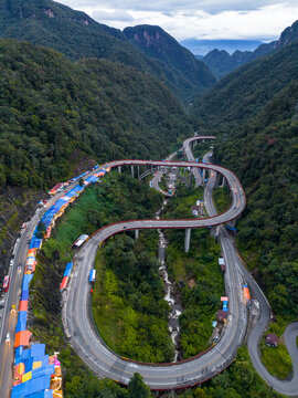 Aerial view of Kelok 9 bridge at dusk. A popular bridge in Sumatra to commute between cities.