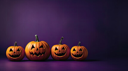 Halloween pumpkins on a dark purple background.