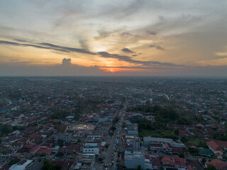 Aerial view of Pekanbaru city skyline during sunset. Capital city of Riau province in Indonesia.