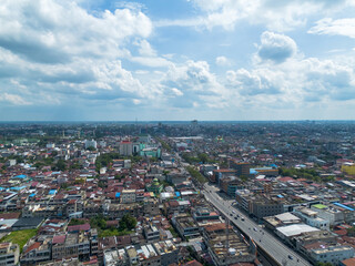Fototapeta na wymiar Aerial View of Pekanbaru city skyline. The capital city of Riau province with many residential buildings.