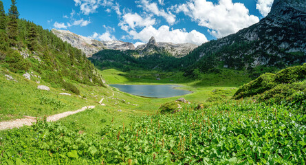 Bavarian hiking nature landscape with lake and scenic mountain background