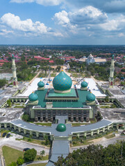 Aerial View of An Nur Great Mosque, Pekanbaru, Riau, Indonesia with blue sky.