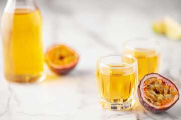Passion Fruit Liqueur in shot glasses. Tropical natural drink