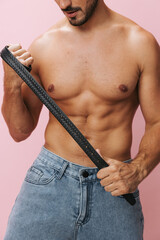 Naked man sport sexy holiday lifestyle jeans muscular pink body torso background fitness muscle belt
