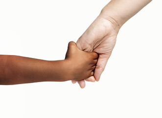 Close up of a caucasian mother giving a hand to an afro child isolated on white background.