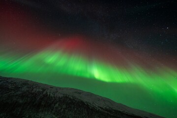 Rare red northern lights, Red Aurora Borealis. High quality photo - 661847948