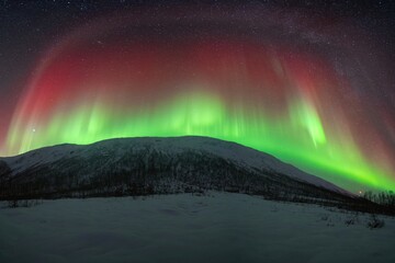 Rare red northern lights, Red Aurora Borealis. High quality photo - 661848512