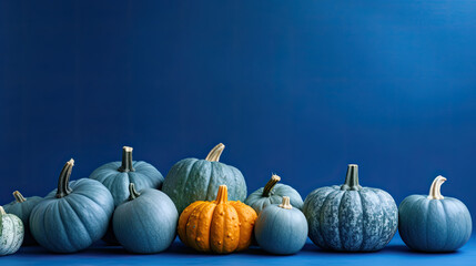 A group of pumpkins on a blue background or wallpaper