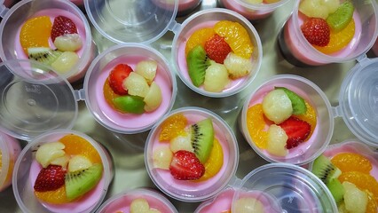 Sweet dessert strawberry pudding with topping several fruits ready to eat