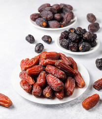 Fresh organic and various sweet dried date fruits.