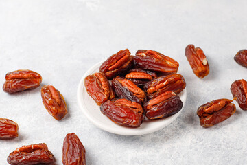 Fresh organic and various sweet dried date fruits.