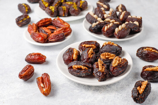 Fresh organic and various sweet dried date fruits.