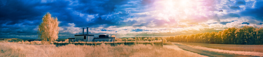 An infrared photo of a house sitting in the middle of a field.