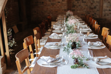 Fototapeta na wymiar Beautiful table decoration at barn wedding