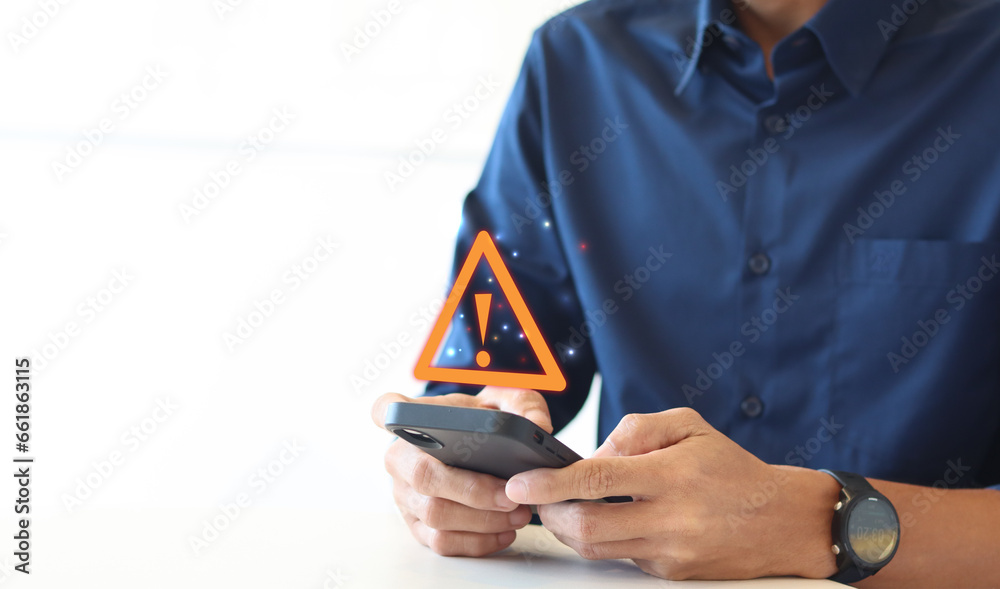 Poster Notification smartphone concept. A Businessman using a phone with a warning symbol indicating the risk of data theft, Hacking passwords, and personal data.