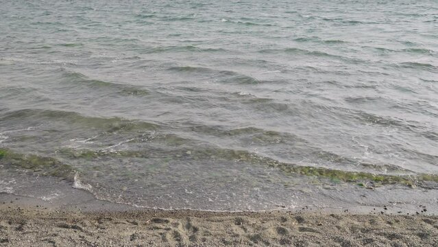 Slow motion closeup shot of clear water waves of a lake
