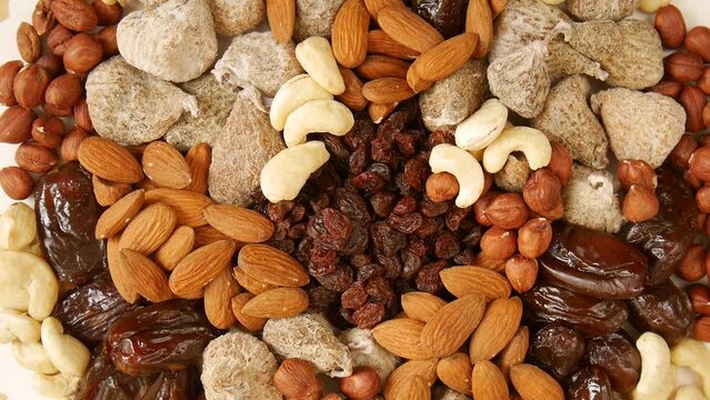 Mixed dried fruit nuts on a plate.