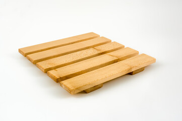 Traditional  hard wood constructed hot pan trivet isolated on a white background