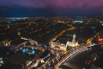 Oradea romania tourism aerial a vibrant cityscape illuminated by the night lights