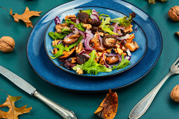 Dietetic mushroom salad with walnuts.