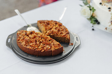 Cut cake at a wedding buffet