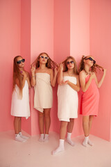 Fototapeta premium four girls in towels and sunglasses