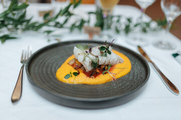 Gourmet dish with fish at a wedding dinner