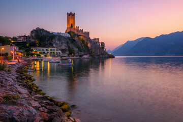 Malcesine town on Lake Garda, Italy, on dramatic sunset - obrazy, fototapety, plakaty