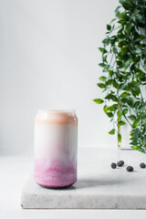 Peach and blueberry yogurt in a can shaped glass, peach blueberry yogurt in a glass shaped like a can, Aesthetic cafe ombre drink in a can glass