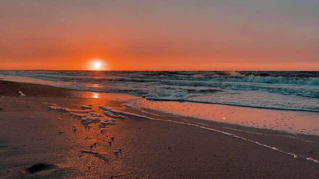 Sunset on the beach in Golubitskaya. Beautiful sunset on the background of the sea. Sunset landscape, amazing light of nature. The background of the nature environment.The Sea of Azov. Golubitskaya 4К
