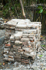 Solid clay brick used for construction, dark red brick. pile of bricks during the construction process.