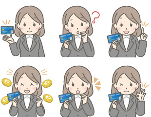クレジットカードを持つ若い女性（スーツ）
