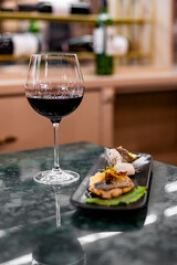 tasting set appetizer food and red wine glass