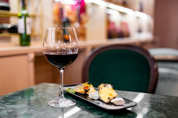 tasting set appetizer food and red wine glass