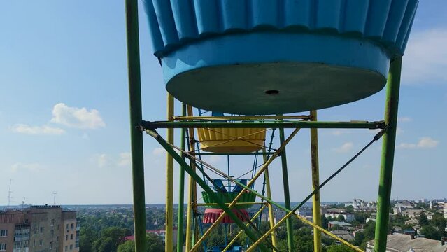 Carnival ride on a Ferris wheel. View from above of the city of Zhitomir, Ukraine.